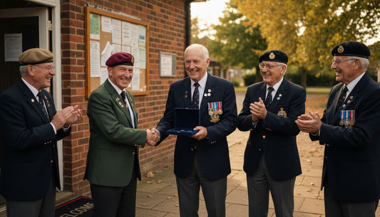 Veterans exchanging commemorative gift at reunion
