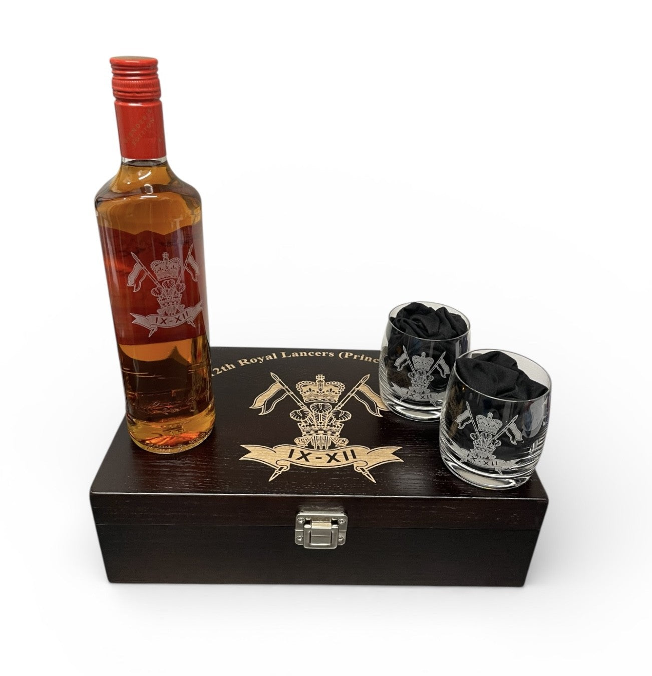 Bottle of whiskey with two glasses on a wooden box with a logo