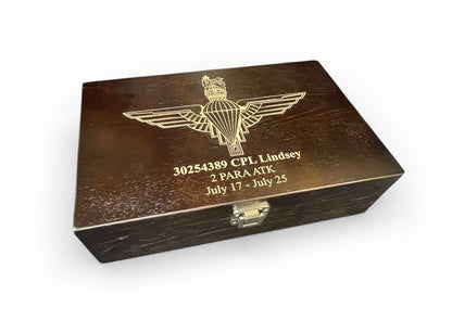 PARA engraved cap badge on wooden bottle box.