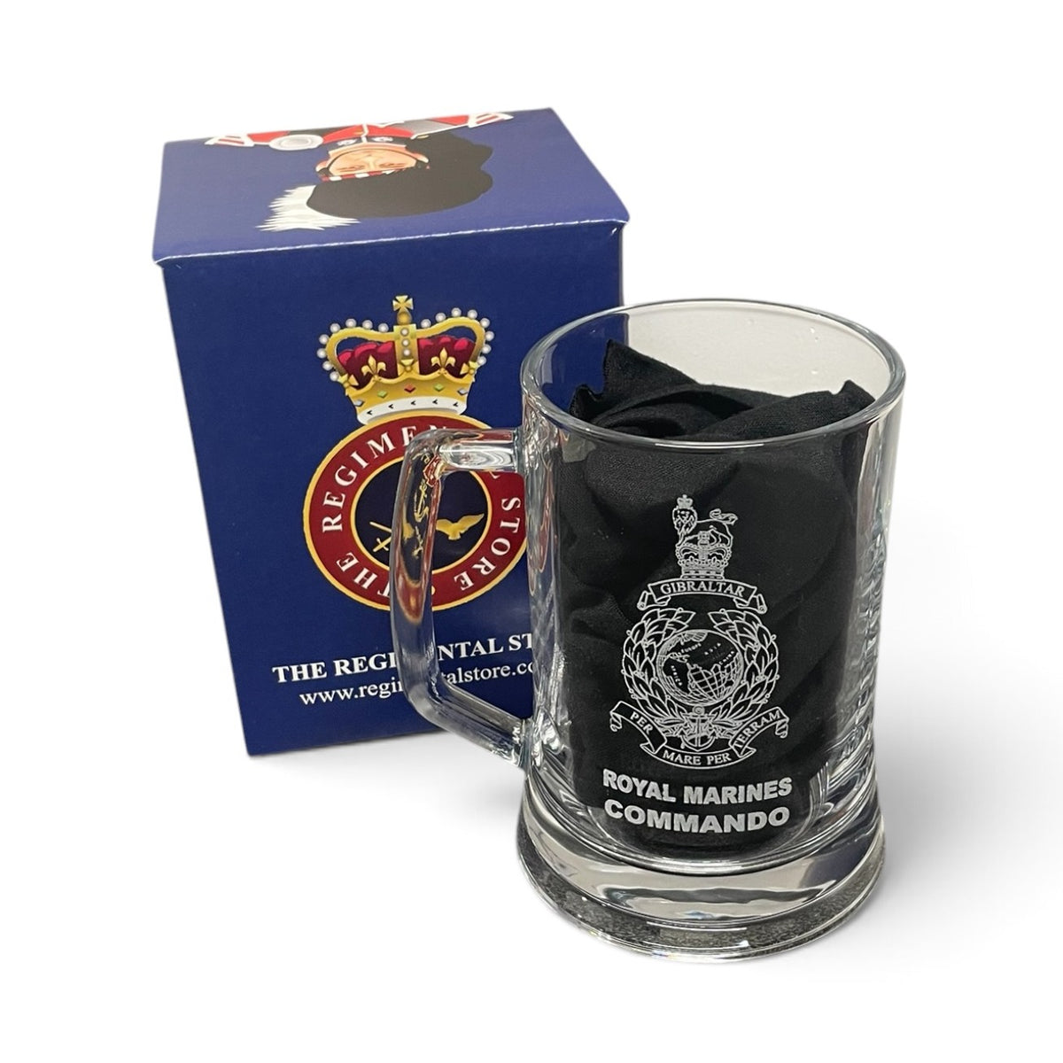 A clear glass mug with a Royal Marines Commando emblem printed on it, shown next to its blue branded box. The mug contains a black cloth insert and is photographed on a clean white background.